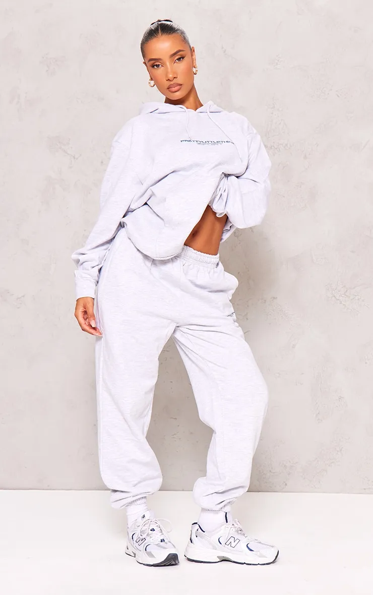 PLT Sport Jogging gris cendré à slogan brodé en gras