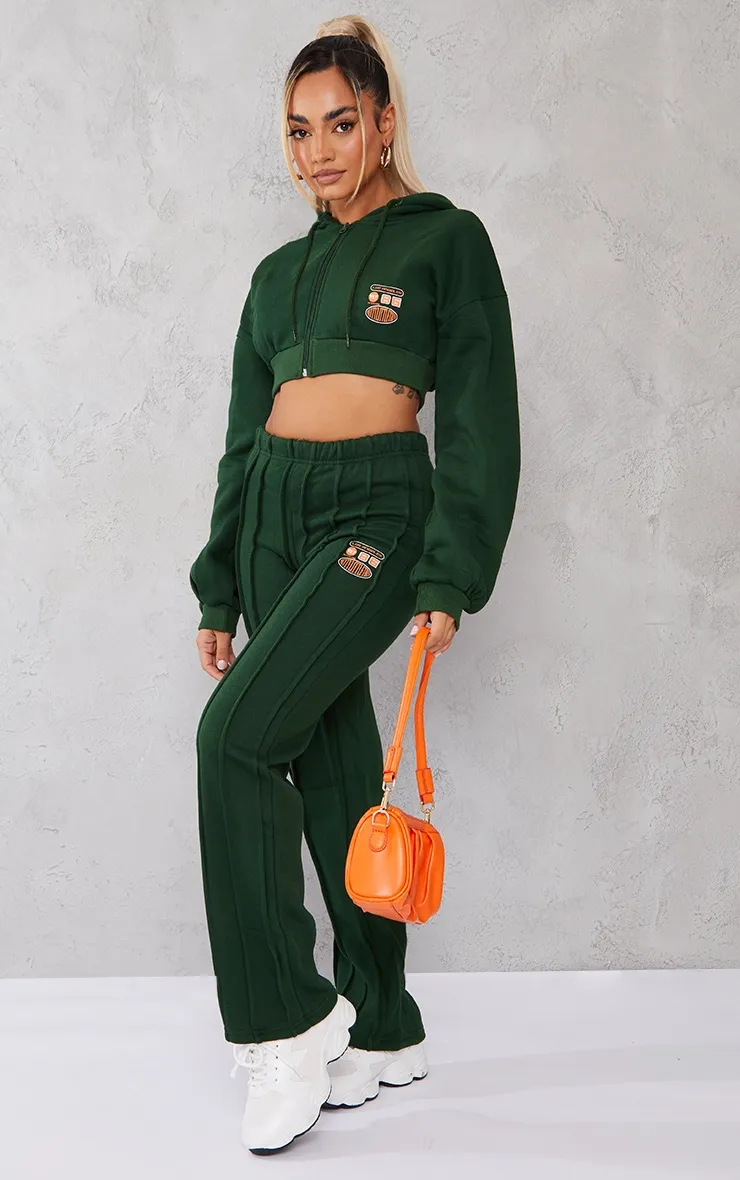 PRETTYLITTLETHING Petite Jogging oversize vert à slogan