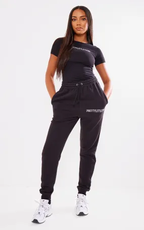 PRETTYLITTLETHING Tall Jogging noir à bas retroussé et taille haute